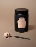 Pot Protéines Vanille WelleCo - 300g. Une cuillère de poudre
